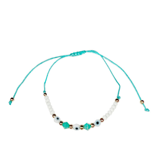 Türkises Stoffarmband mit goldenen, weißen und türkisen Perlen mit integriertem Nazar Auge.