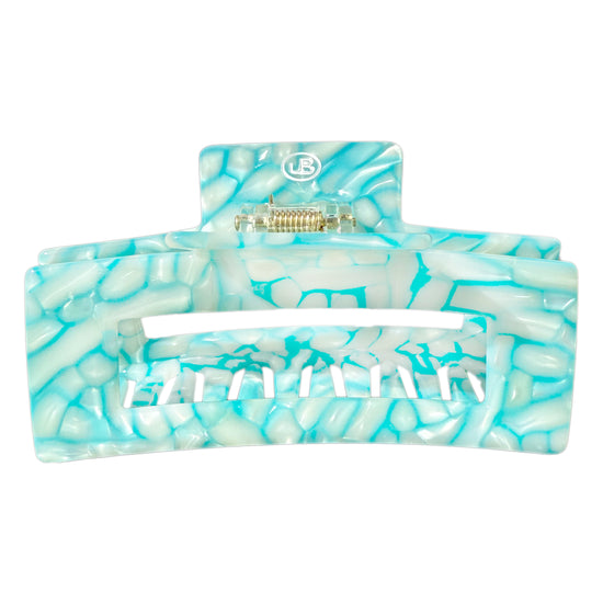 Türkise Haarklammer aus Cellulose Acetet in flimmernder Pooloptik.