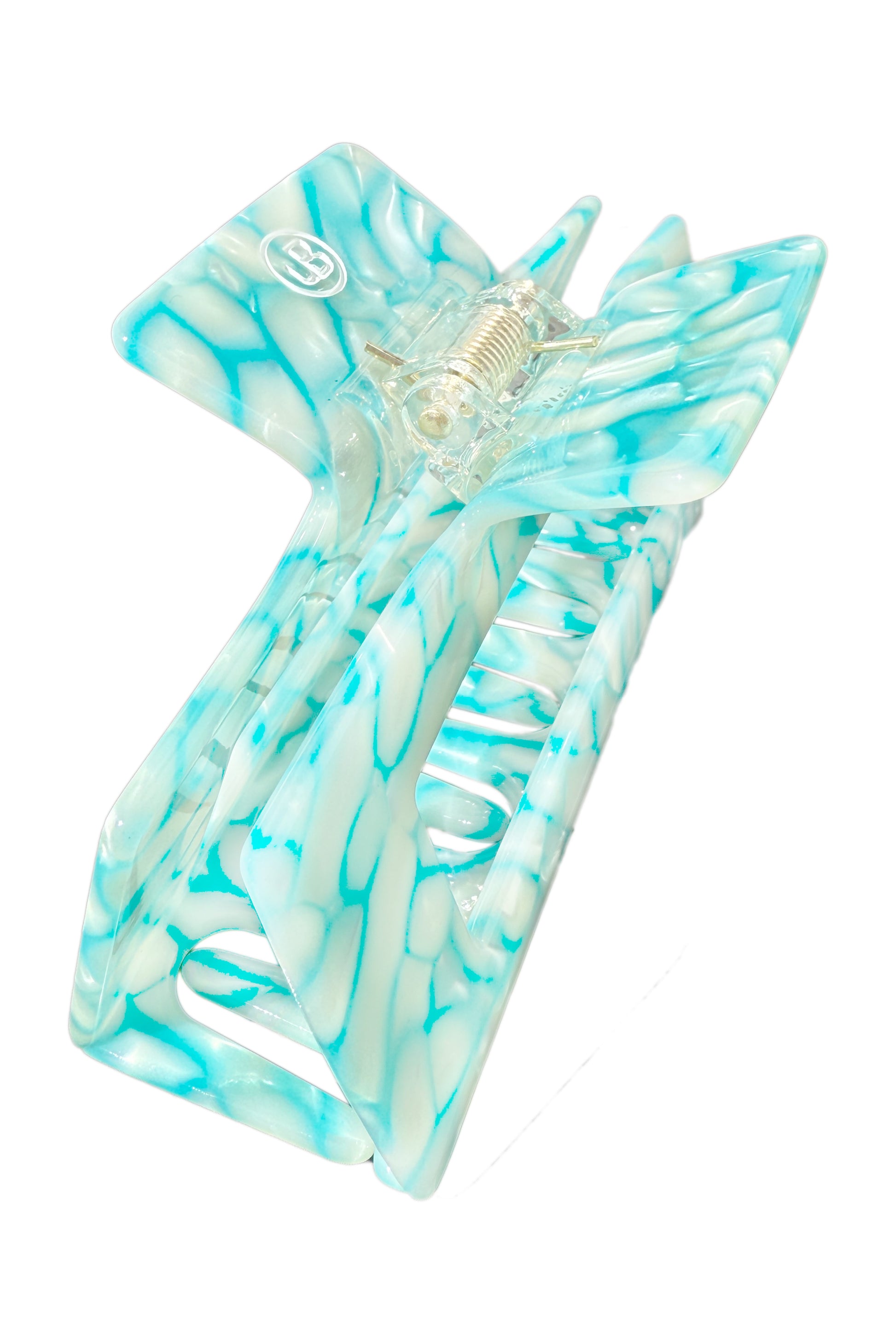 Türkise Haarklammer aus Cellulose Acetet in flimmernder Pooloptik.