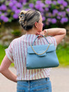 edle Handtasche mit Goldkette und Wildleder Optik