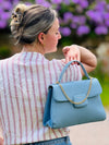 edle Handtasche mit Goldkette und Wildleder Optik