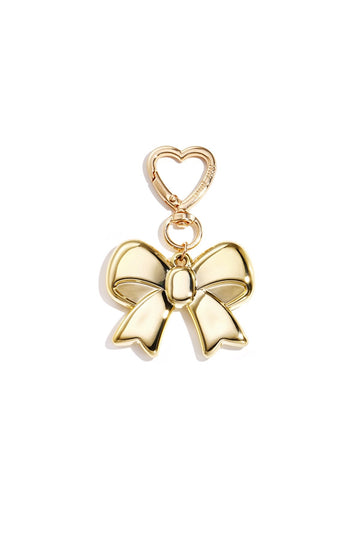 Goldfarbener Schleifen Taschenanhänger mit herzförmigem Karabiner, freigestellt