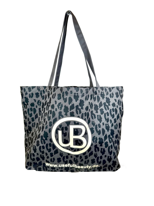 Dunkelgraue Tragetasche mit Leo Muster mit useful Beauty Logo
