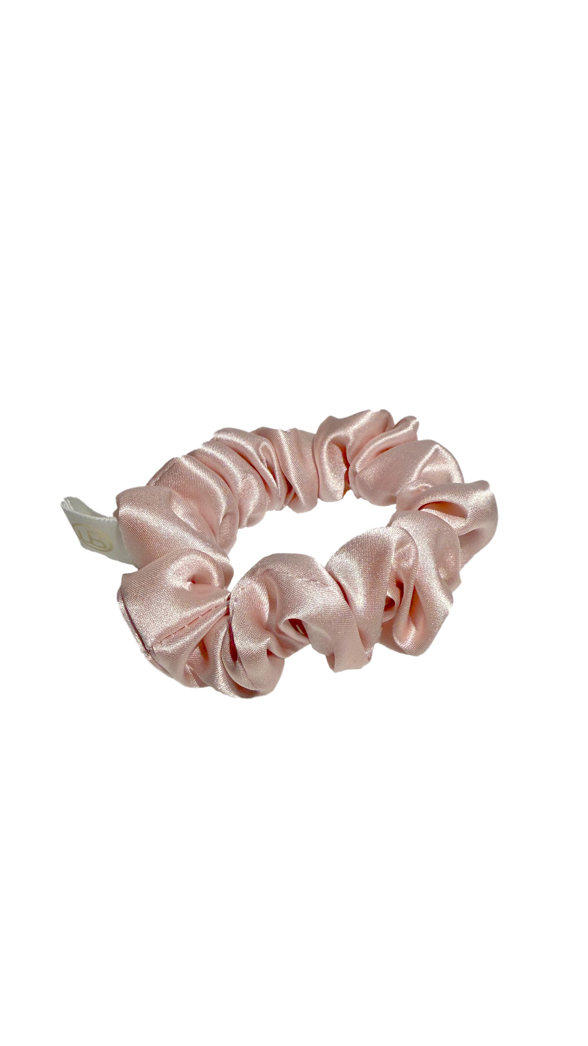 Rosé farbener Seidenscrunchie in mittlerer Größe.