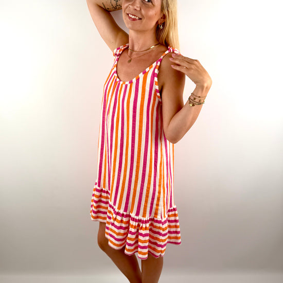 Kurzes Musselin Klied mit einstellbaren Spaghetti Trägern in sommerlichen grellen Farben.