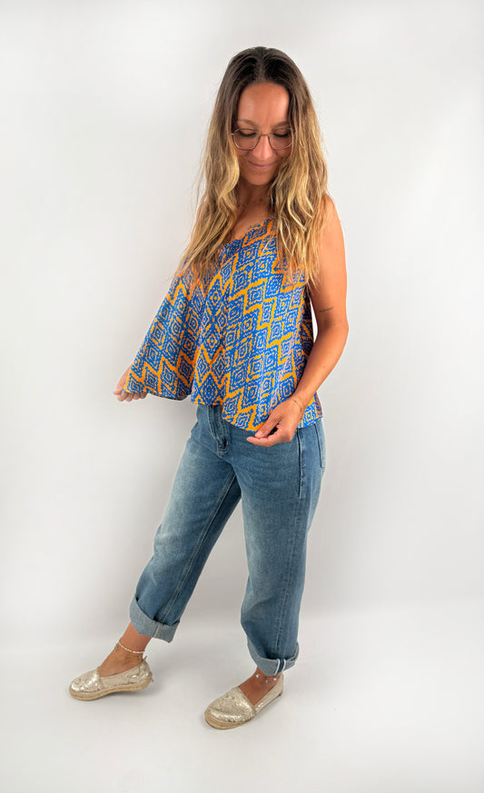 Gemustertes Tanktop aus Viskose in Blau und Orange.