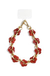 Handykette mit goldener Gliederkette und roten Acryl-Blumen auf weißem Hintergrund